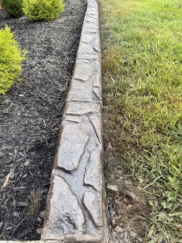 Close-up of the stone-like texture on decorative curbing