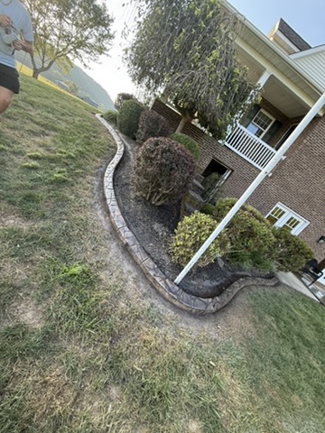 After: A curved edge defines the garden in front of the home.